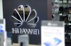 A Huawei Technologies Co. logo sits on display in a store.