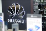 A Huawei Technologies Co. logo sits on display in a store.