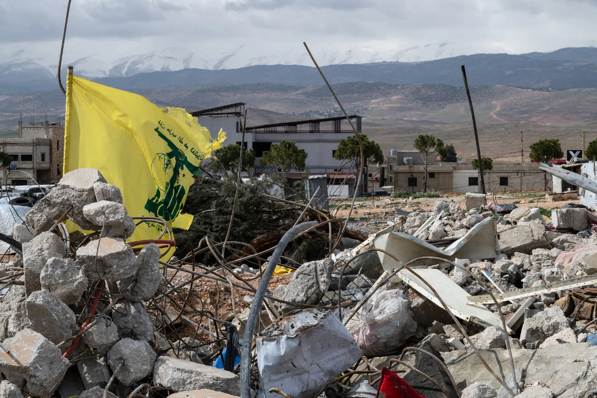 A Hezbollah flag in the rubble following an air strike in Valley, Lebanon, on March 23.