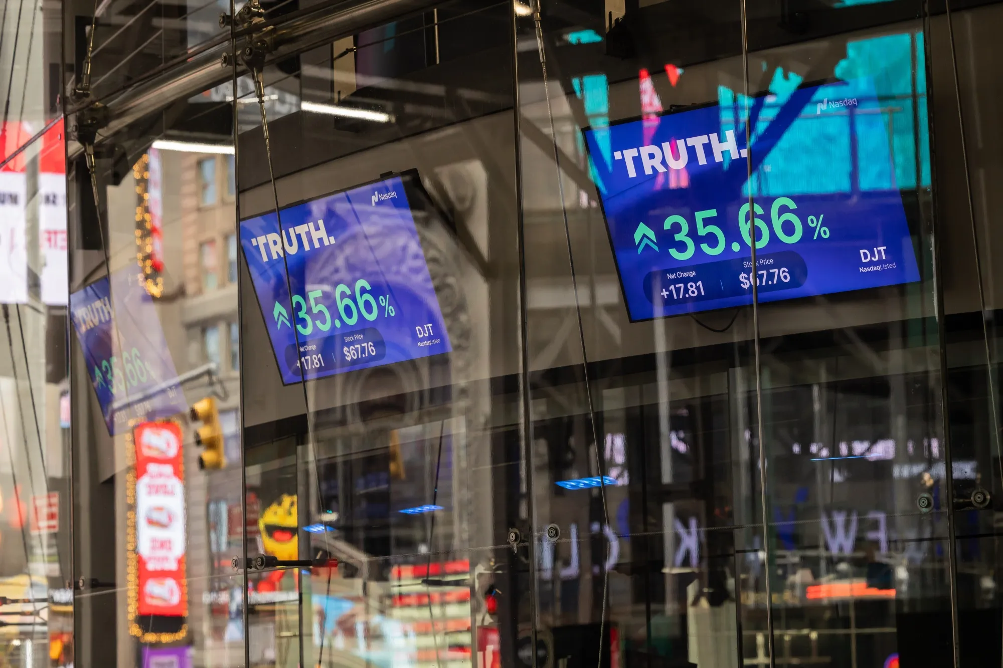Screens displaying Truth Social stock information outside the Nasdaq MarketSite in New York&nbsp;on Tuesday.