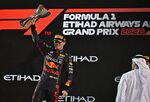 Max Verstappen raises the winner's trophy on the podium after the Abu Dhabi Formula One Grand Prix&nbsp;on Nov. 20.