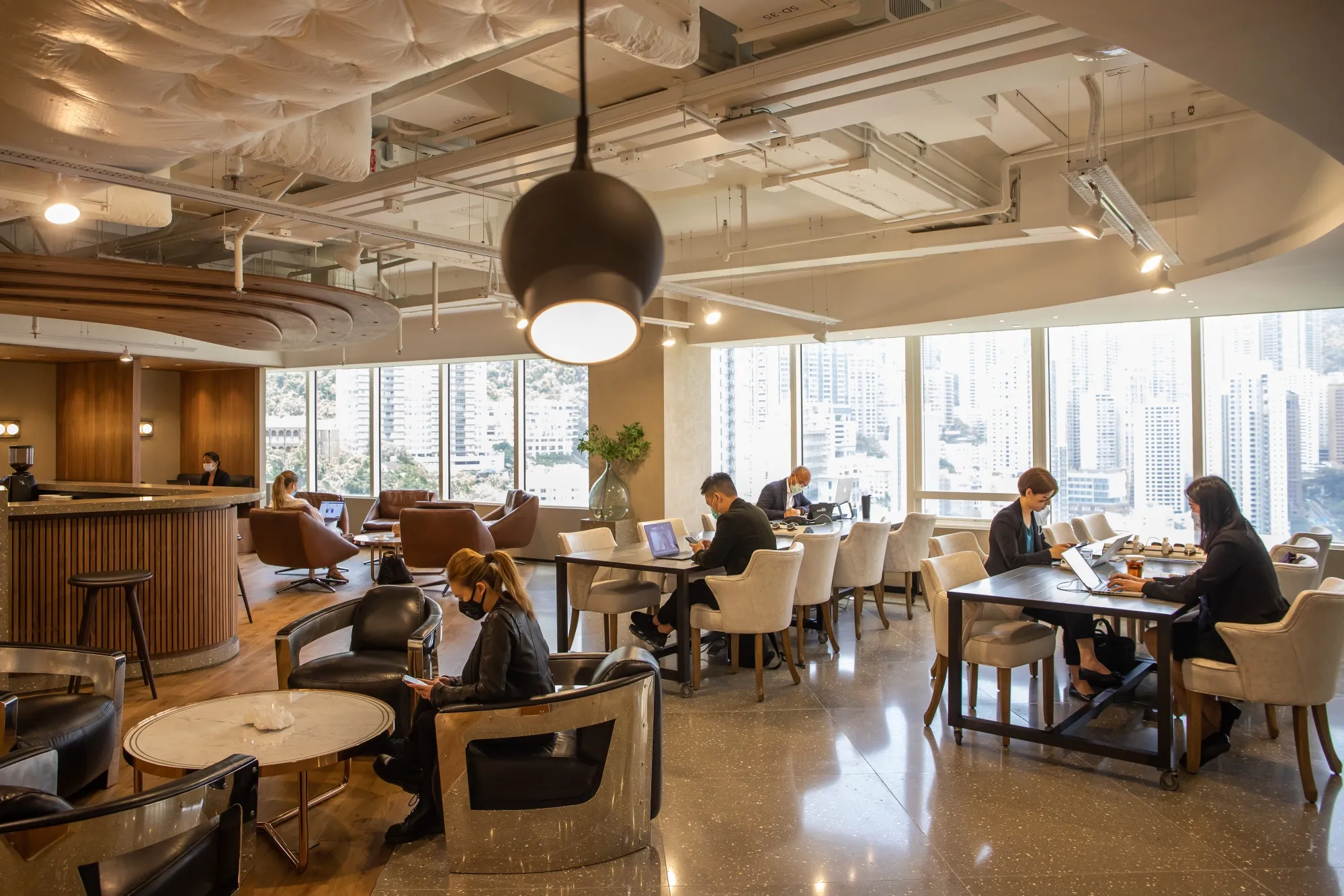 People work in the communal area at the Executive Centre in Hong Kong, April 16.