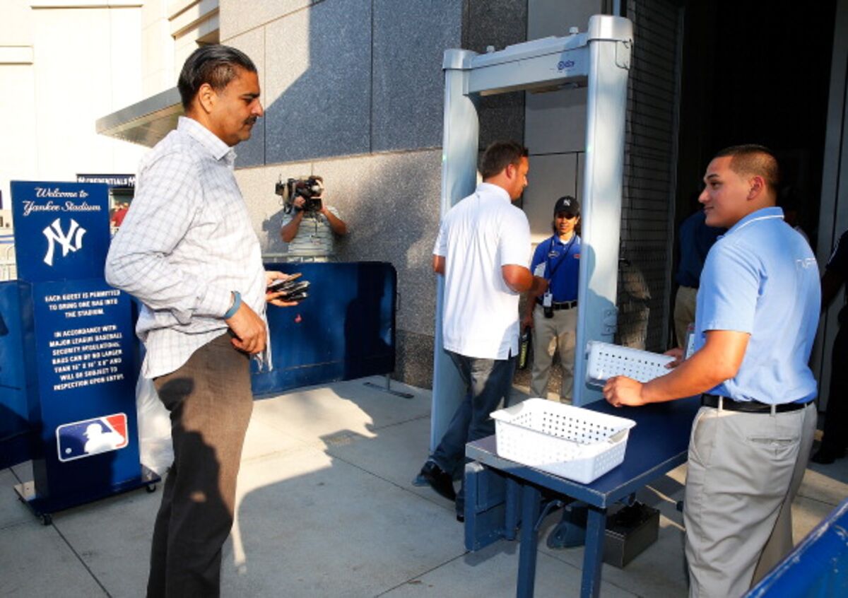 Fans go through metal detectors at Yankee Stadium