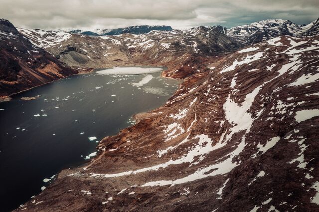 The Tanbreez mining deposit, viewed from the air, rings the fjord.