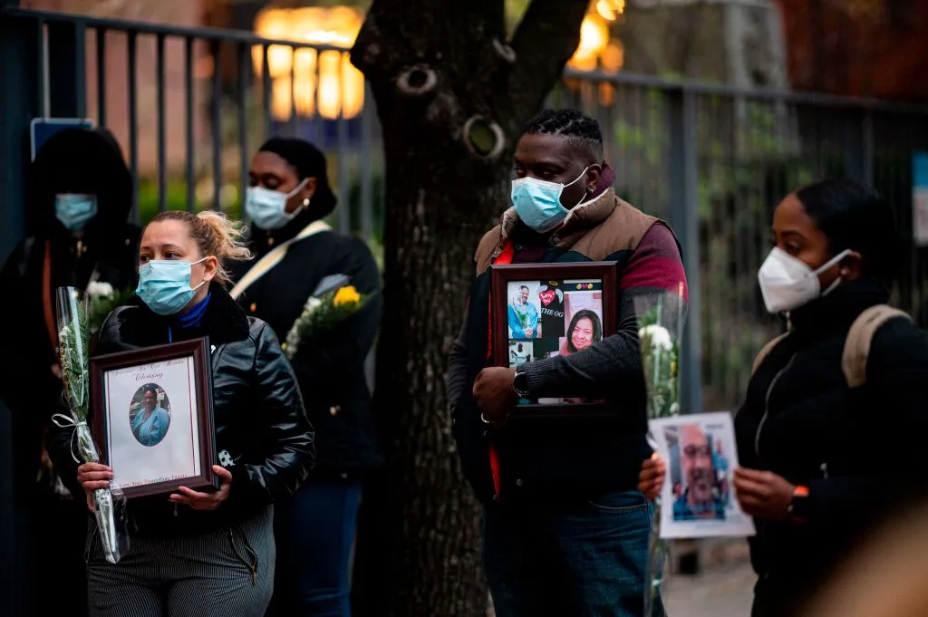 TOPSHOT - Nurses and healthcare workers mourn and remember their colleagues who died during the outbreak of the novel coronavirus (which causes COVID-19) during a demonstration outside Mount Sinai Hospital in Manhattan on April 10, 2020 in New York City. - The global coronavirus death toll topped 100,000 on April 10 as Easter celebrations around the world kicked off in near-empty churches with billions of people stuck indoors to halt the pandemic's deadly worldwide march. (Photo by Johannes EISELE / AFP) (Photo by JOHANNES EISELE/AFP via Getty Images)
