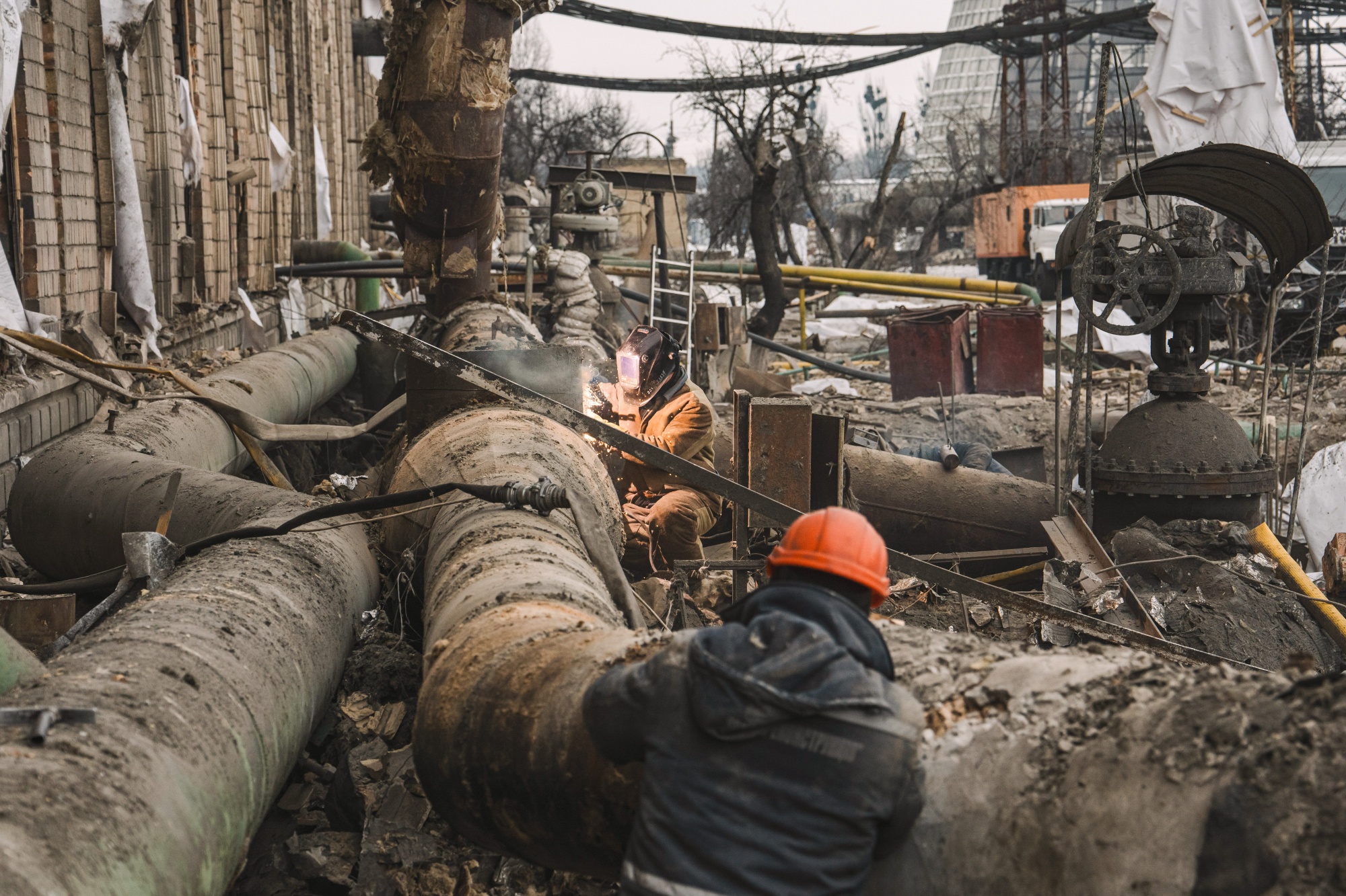 Workers cut damaged pipework at the Darnytsia Thermal Power Plant following Russian air strikes in Kyiv, Ukraine, on Wednesday, Feb. 4, 2026. Russia has continued to attack Ukrainian infrastructure, crippling the war-battered nation’s energy system and leaving millions without heat or electricity during freezing winter weather.