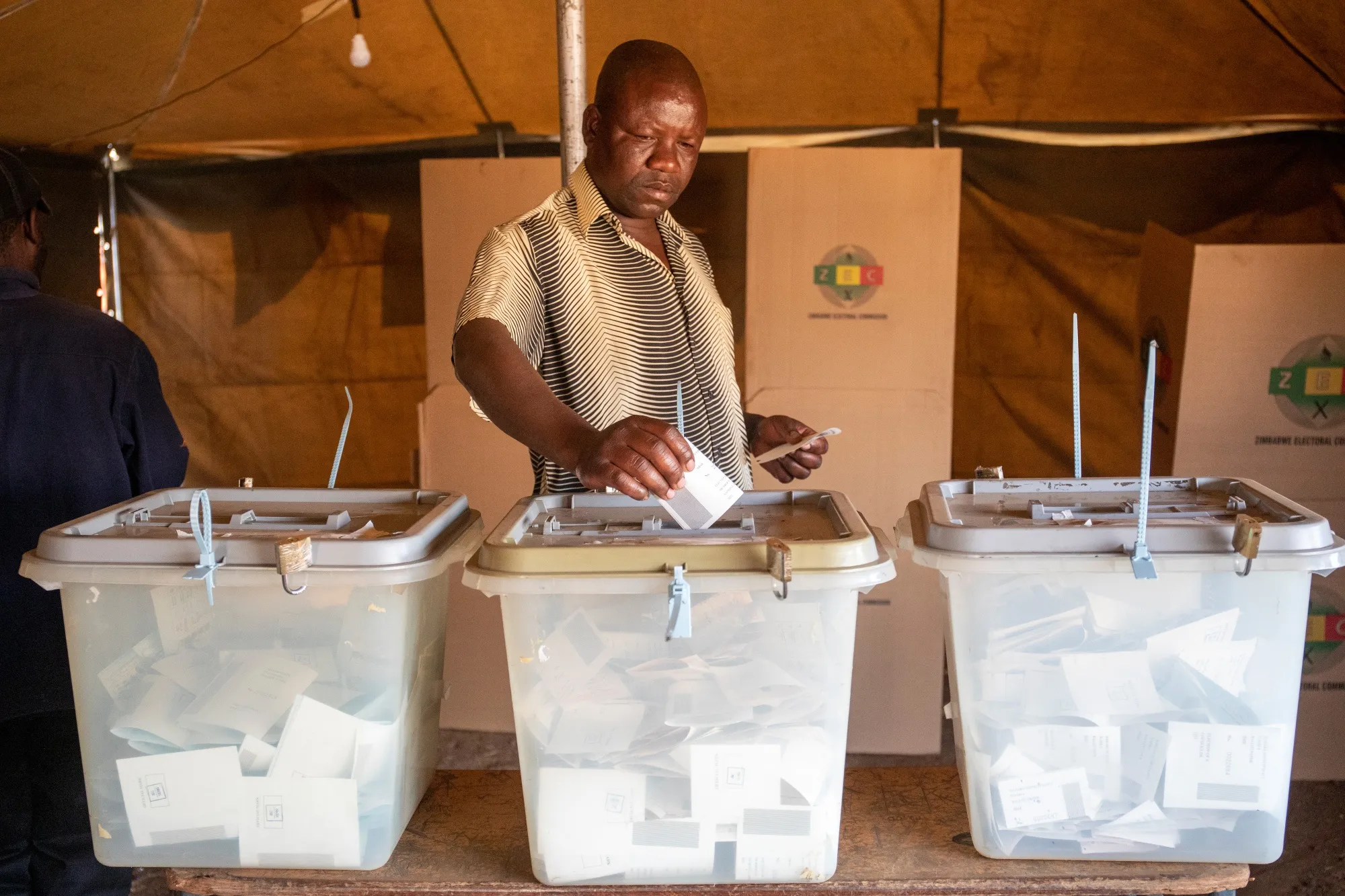 A voter casts their ballot at a polling station in Harare, Zimbabwe in August 2023.