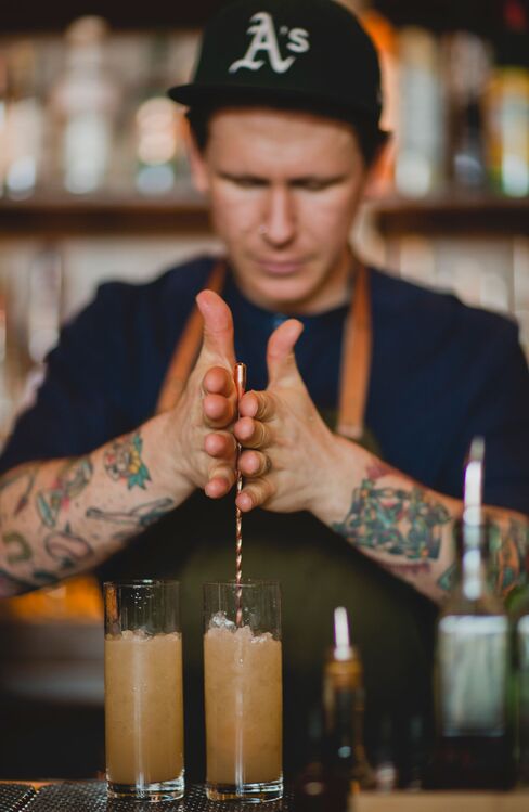Griffiths mixing a drink on his sustainable bar whistle-stop tour.