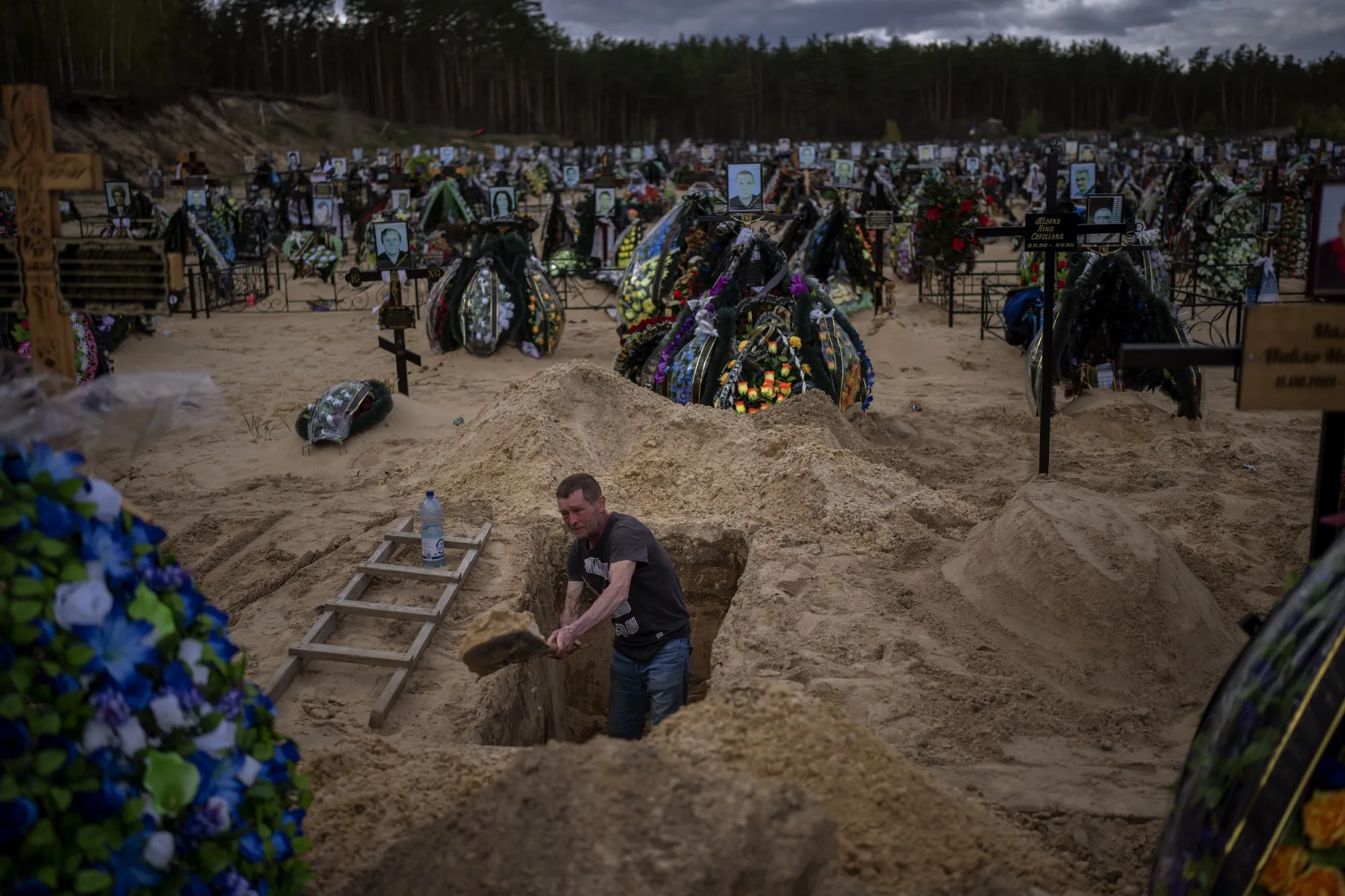 A grave digger works&nbsp;at the cemetery in Irpin, on the outskirts of Kyiv, on&nbsp;April 27.