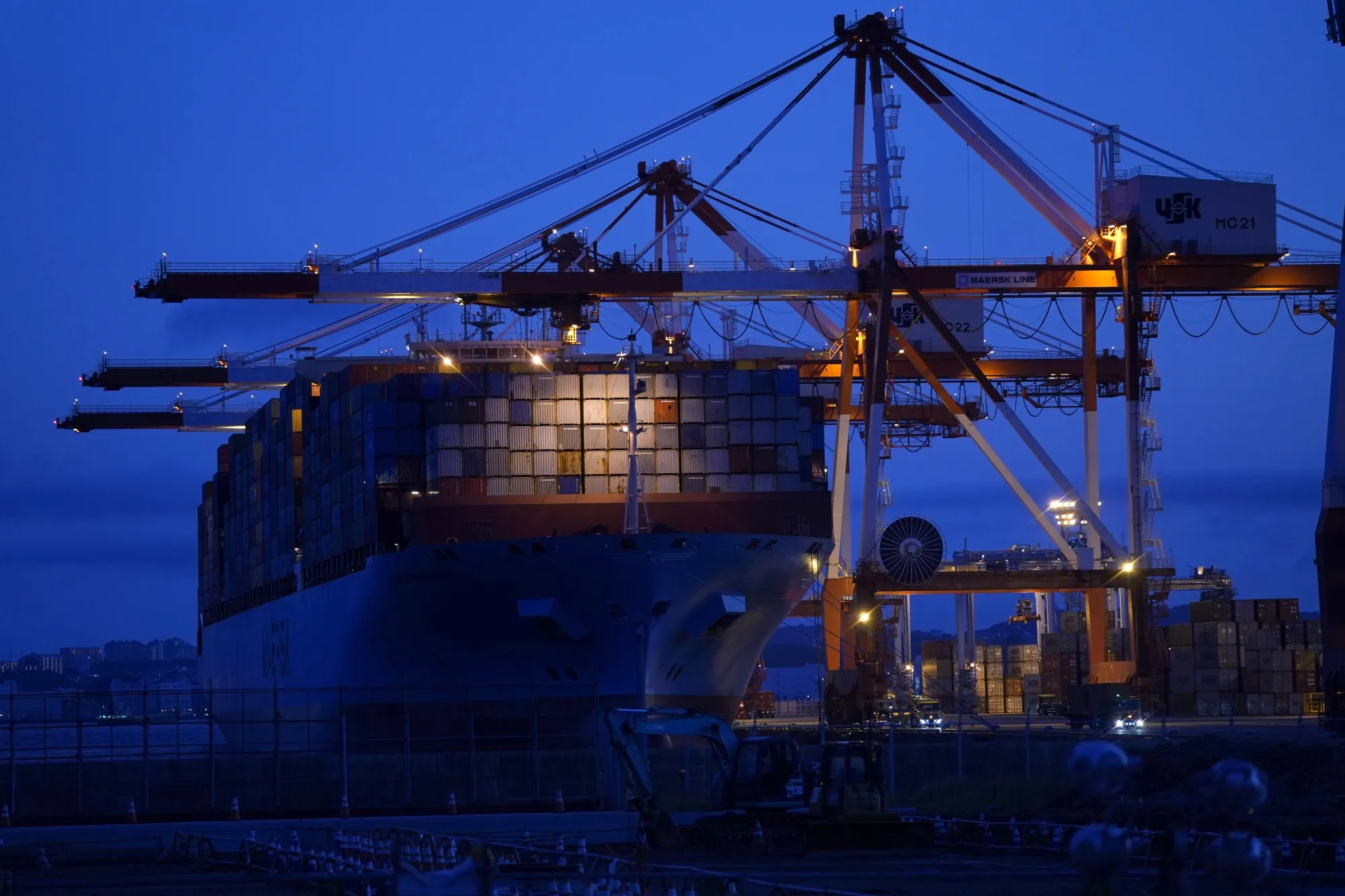 A container ship sits moored at a shipping terminal in Yokohama on July 19.