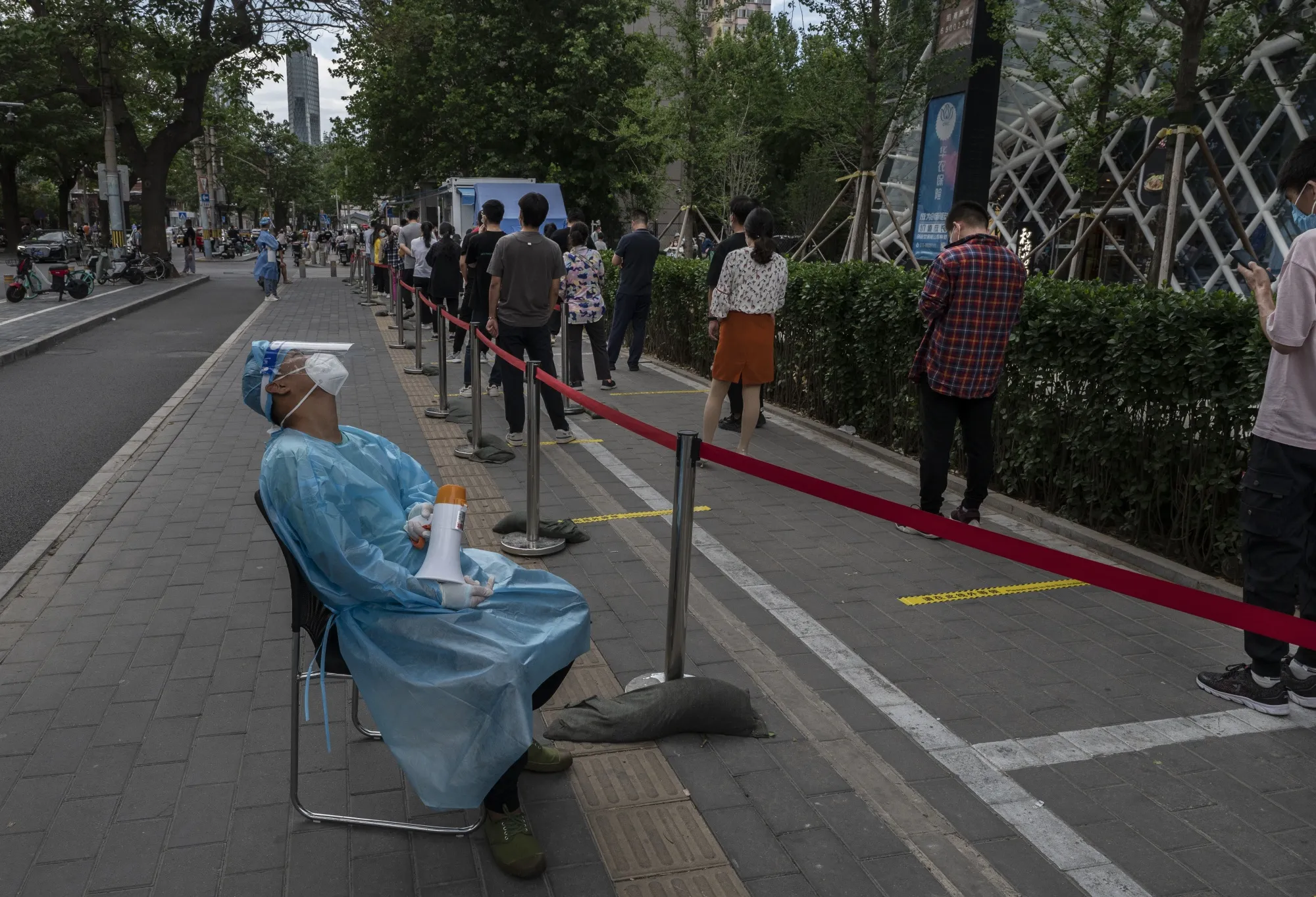 Residents line up to be tested in Beijing on June 14.
