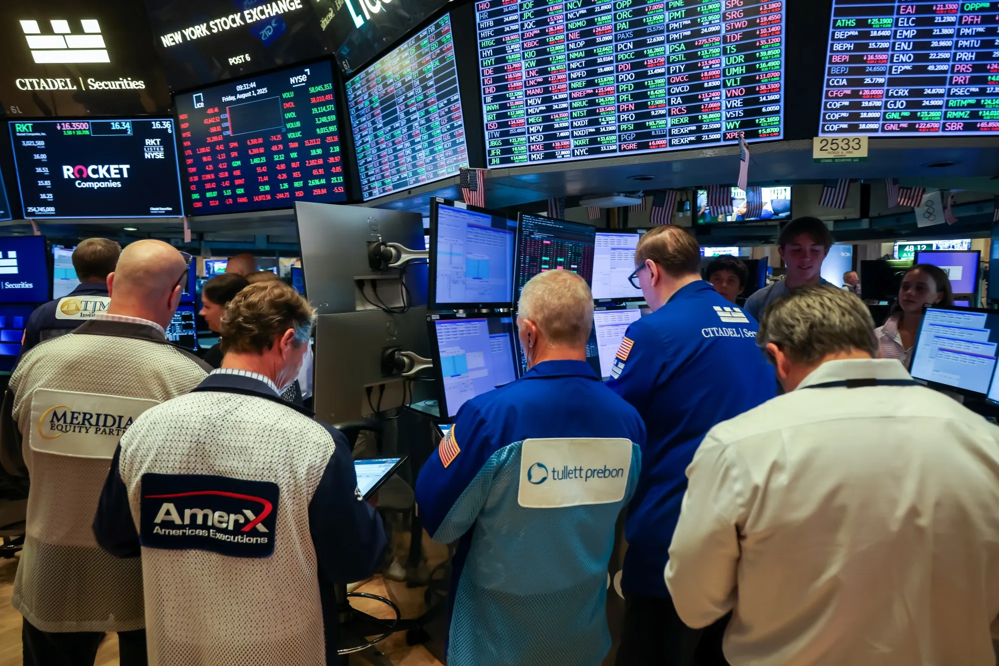Traders work on the floor of the New York Stock Exchange.