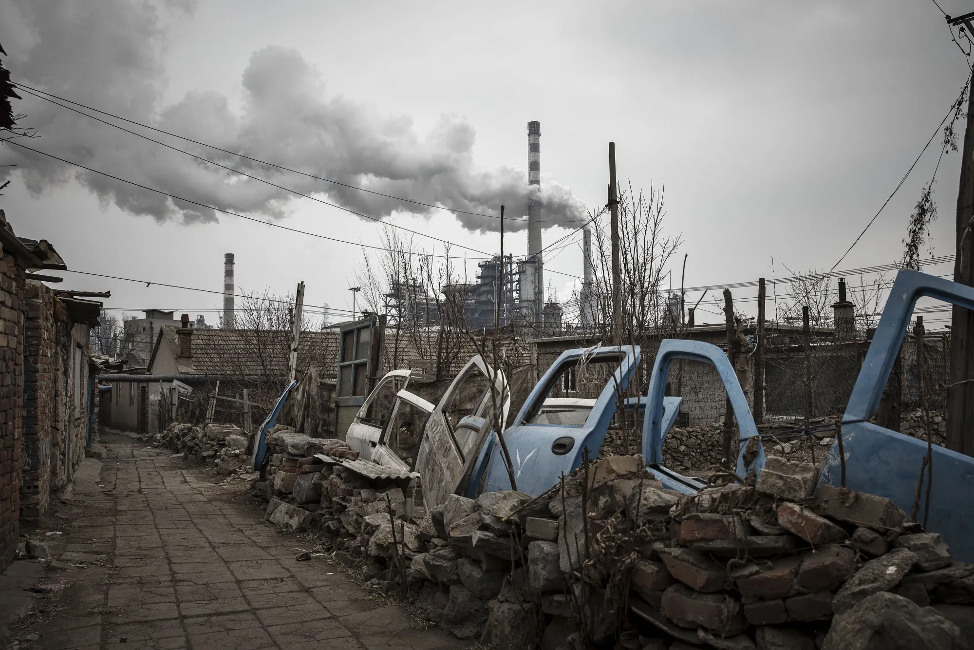 Smoke billows from chimneys of a factory&nbsp;in Dalian, China.