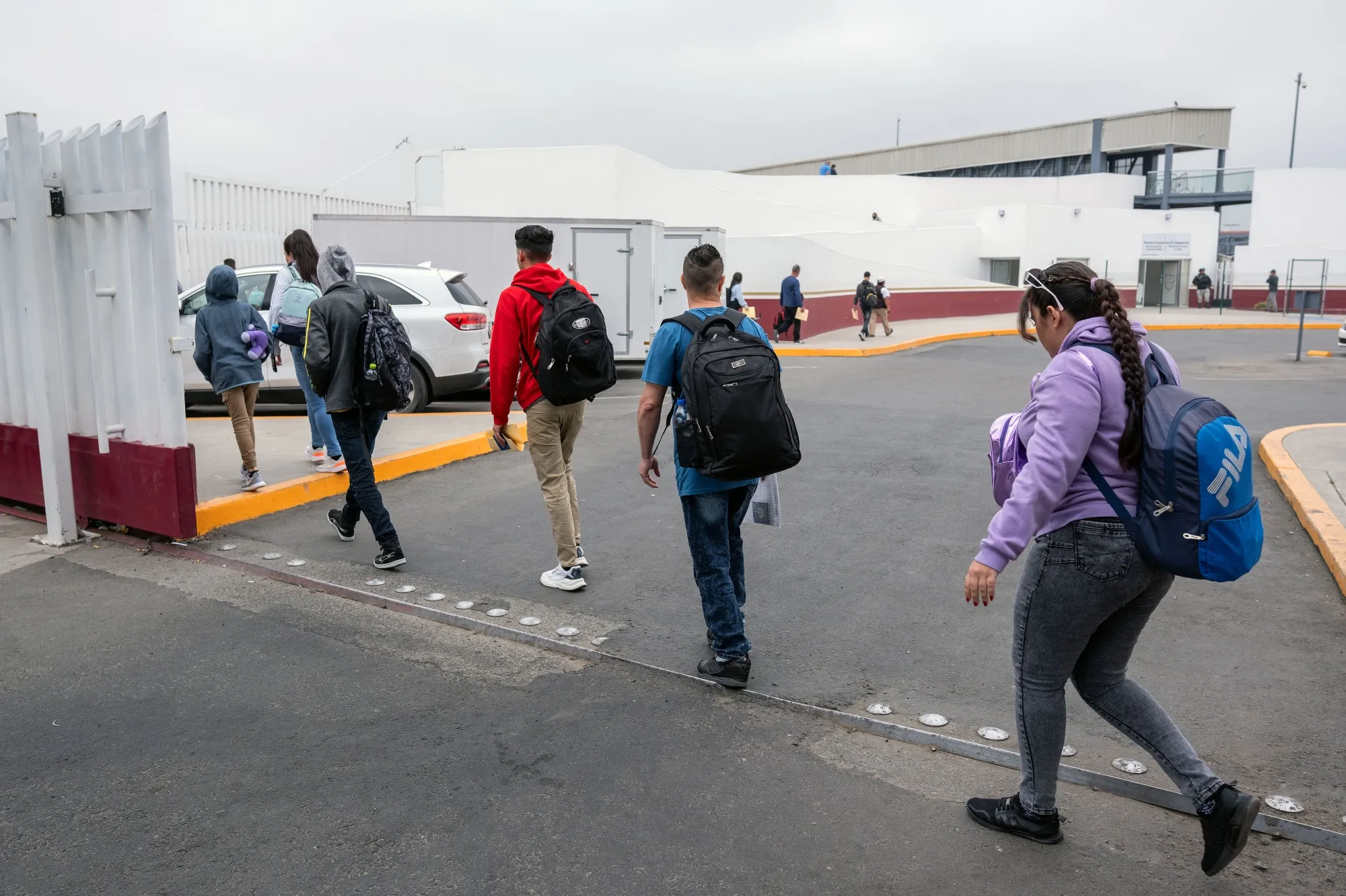 Migrants&nbsp;at the El Chaparral crossing port at the US-Mexico border in Tijuana, Mexico.