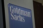 A Goldman Sachs Group Inc. logo hangs on the floor of the New York Stock Exchange.