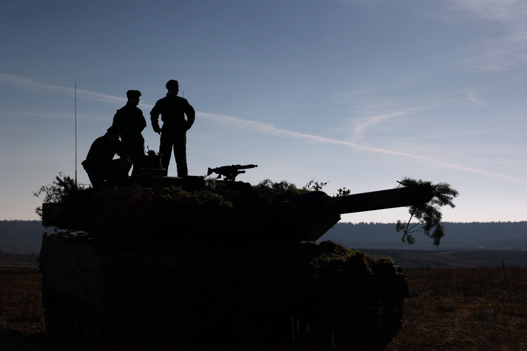 Soldiers on a tank turret during the North Atlantic Treaty Organization (NATO) Brilliant Jump 2024 exercise in Drawsko Pomorskie, Poland, on&nbsp;Feb. 26.