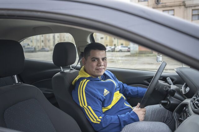 A portrait of Ezequiel Ruiz inside his car. 