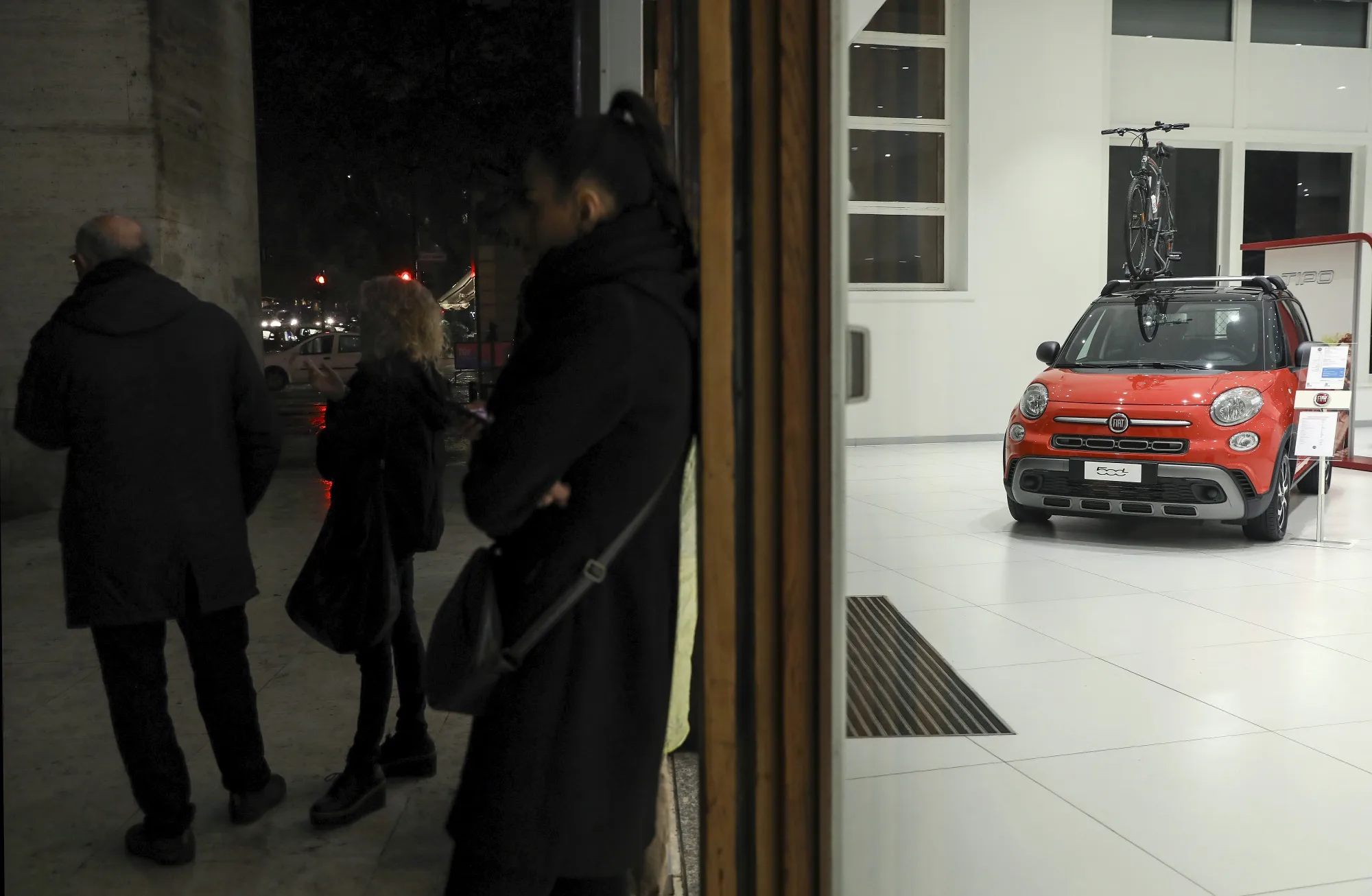 Fiat Chrysler Automobiles automobiles for sale inside a car dealerships in Rome.