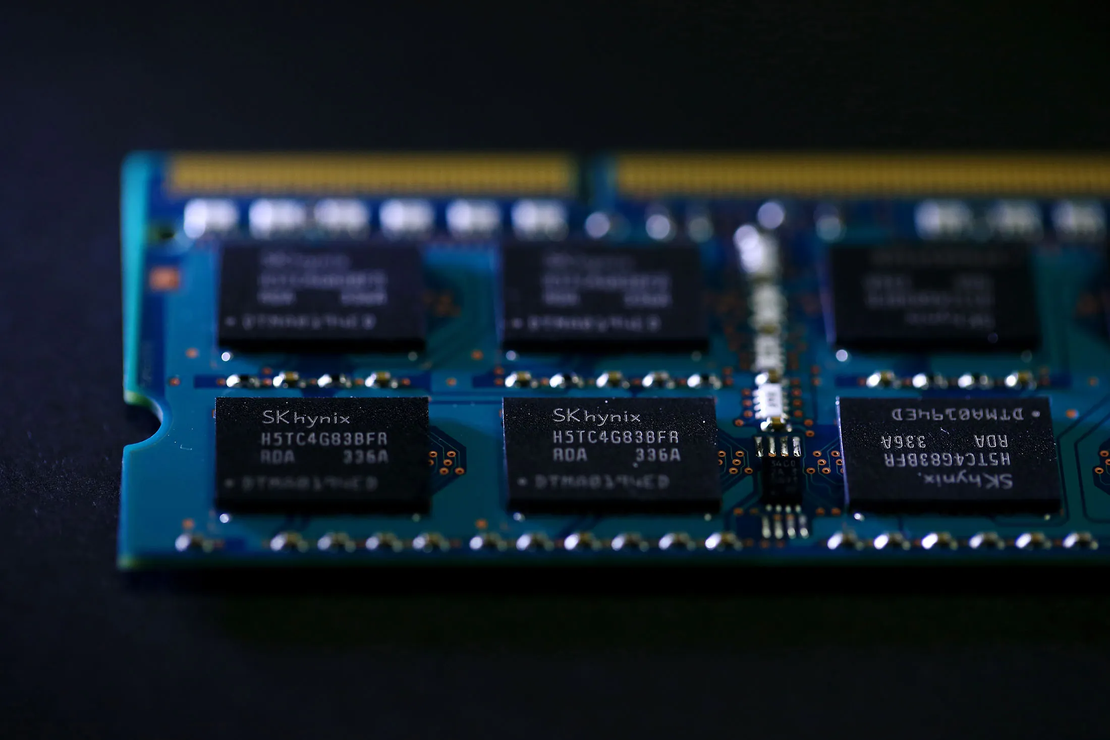 An SK Hynix Inc. 4GB DDR3 memory chip is arranged for a photograph at the company's office in Seoul, South Korea, on Monday, Jan. 27, 2014. SK Hynix, the world's second-largest maker of memory chips, is scheduled to release fourth-quarter results on Jan. 28.
