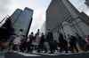Commuters cross a road in Tokyo, Japan, on Friday, March 22, 2019. Japan's Ministry of Internal Affairs and Communications will release jobs date on March 29.
