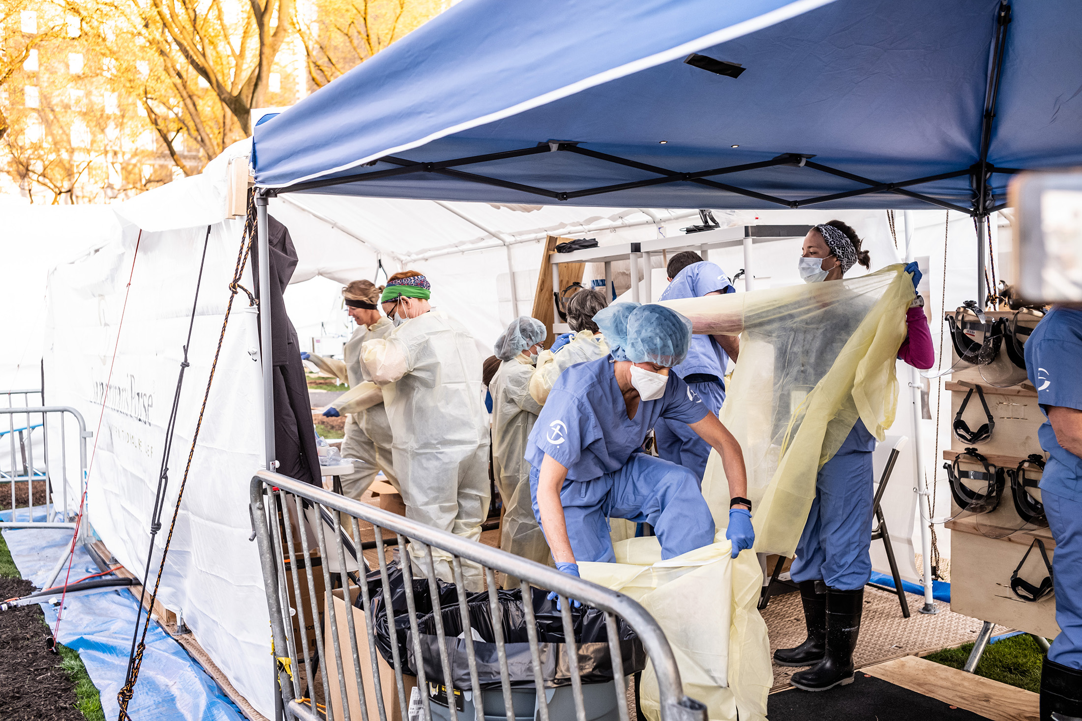 Medical workers putting on PPEs at the beginning of their shift at the emergency field hospital in Central Park on April 08.
