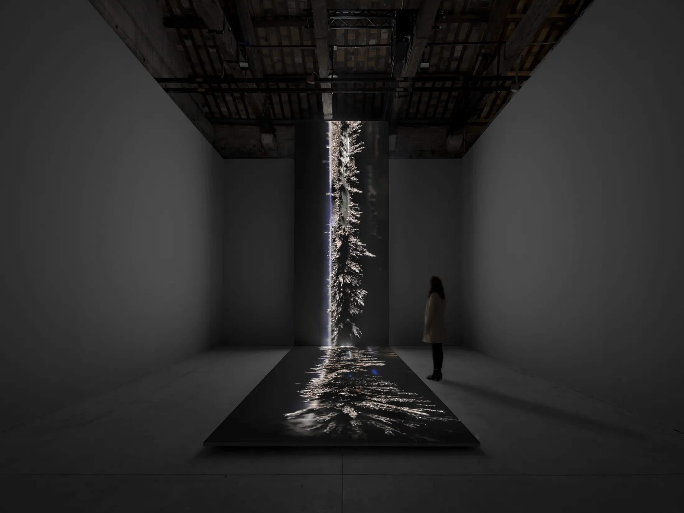 In the Icelandic Pavilion, a&nbsp;20-foot-high video of drifting metallic dust by Sigurdur Gudjonsson.