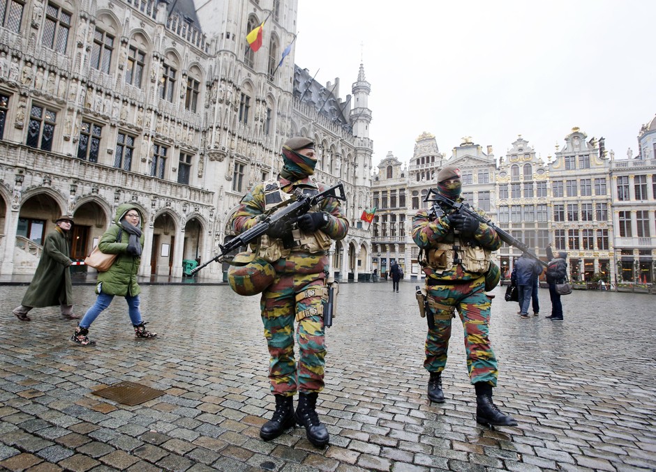 Belgium police officers patrol the Grand Place in central Brussels on November 24, 2015.