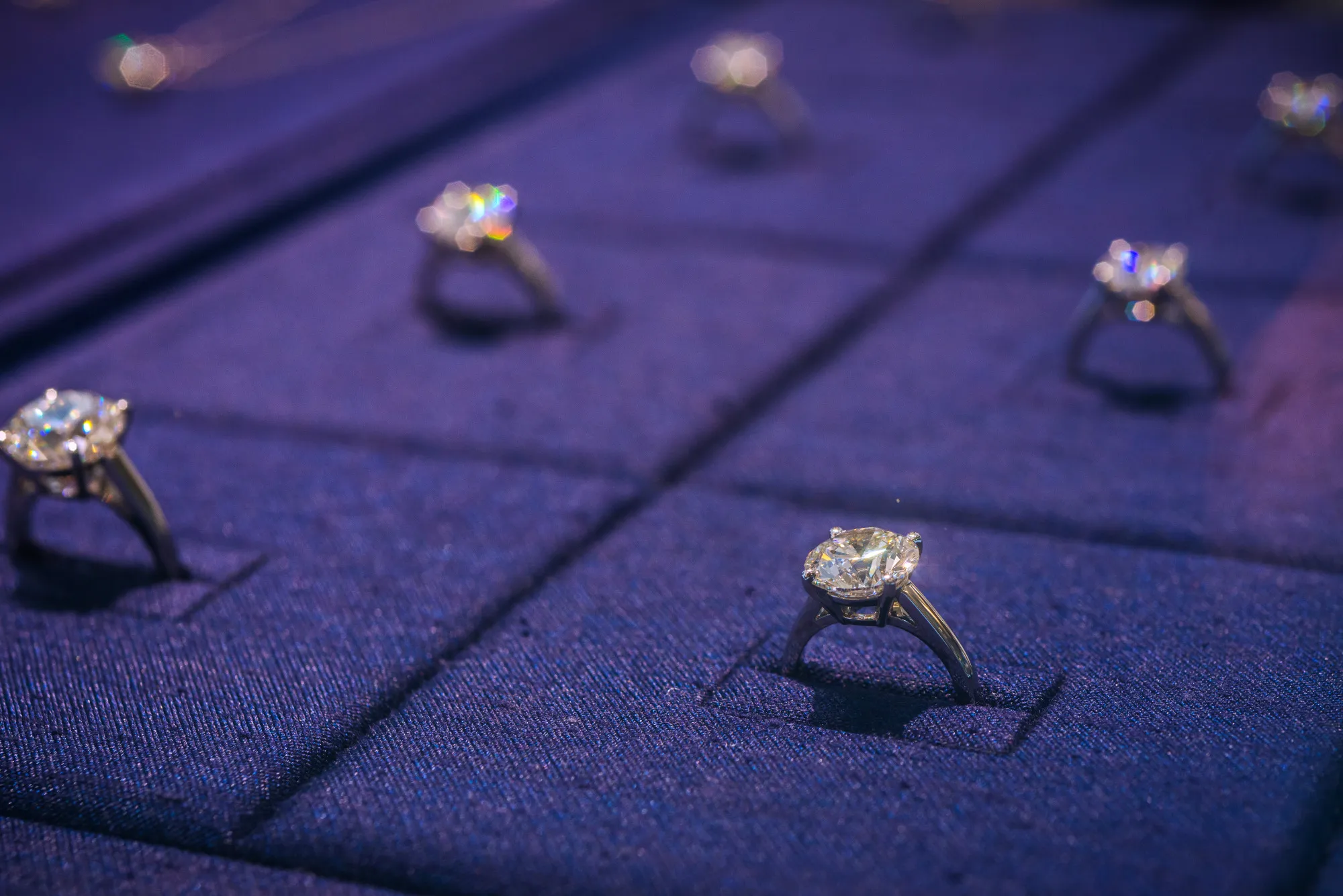 Diamond rings are displayed in a cabinet inside a De Beers SA store in Hong Kong.