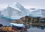 An iceberg grounded outside the village of Innarsuit, an island settlement in the Avannaata municipality in northwestern Greenland, shown on July 13, 2018.