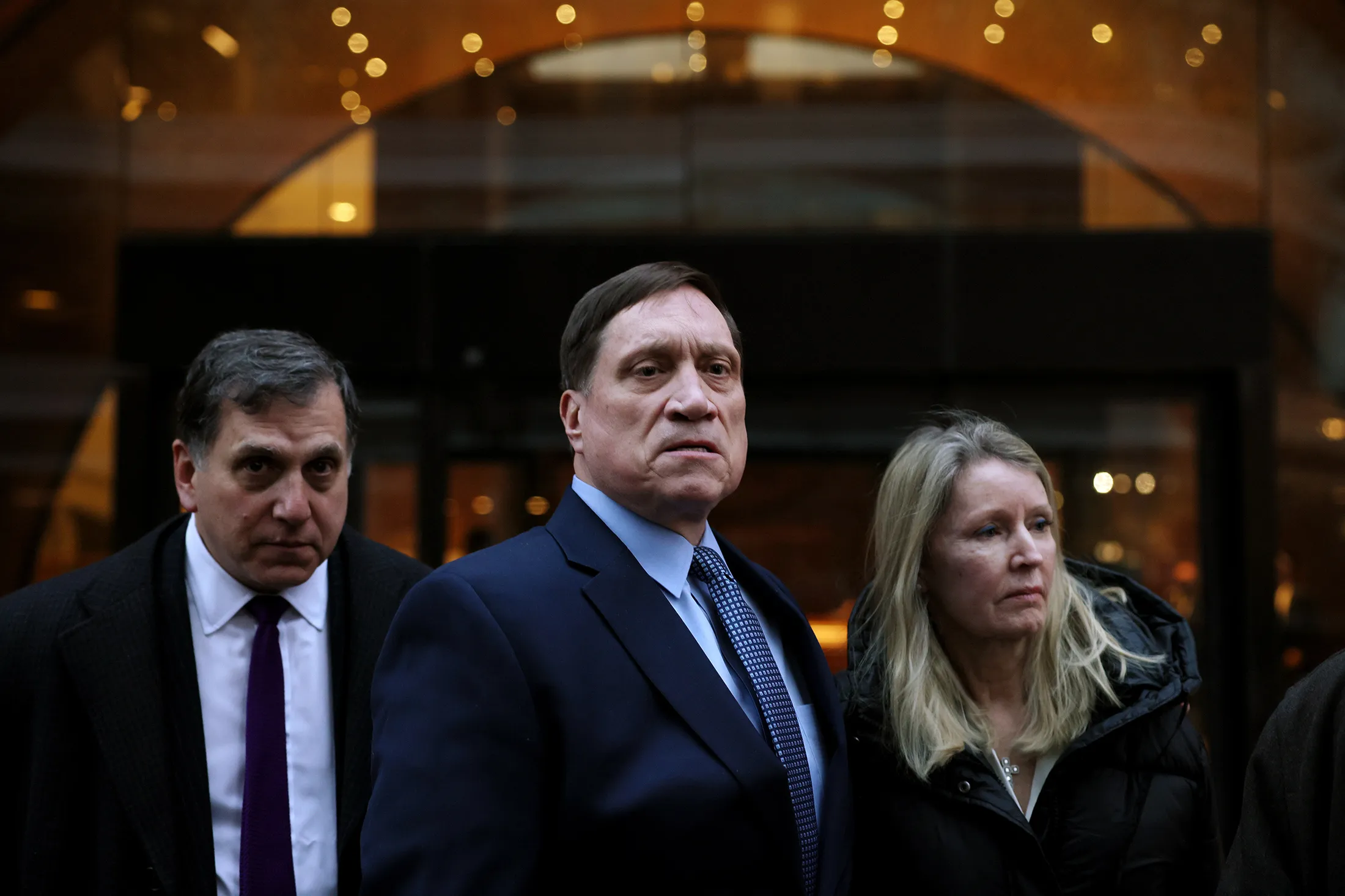 John B. Wilson, center, leaves the Moakley Federal Courthouse following his sentencing hearing in Boston, Massachuesetts, on Feb. 16, 2022.