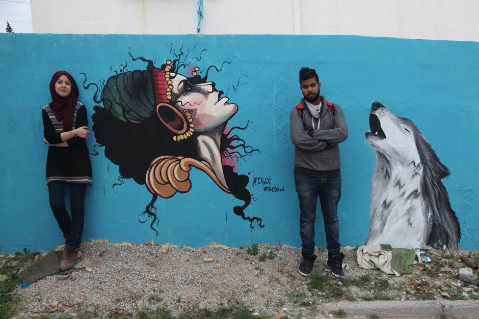 Members of the 4 Street Family collective with their work in Ezzahra, a suburb of Tunis.