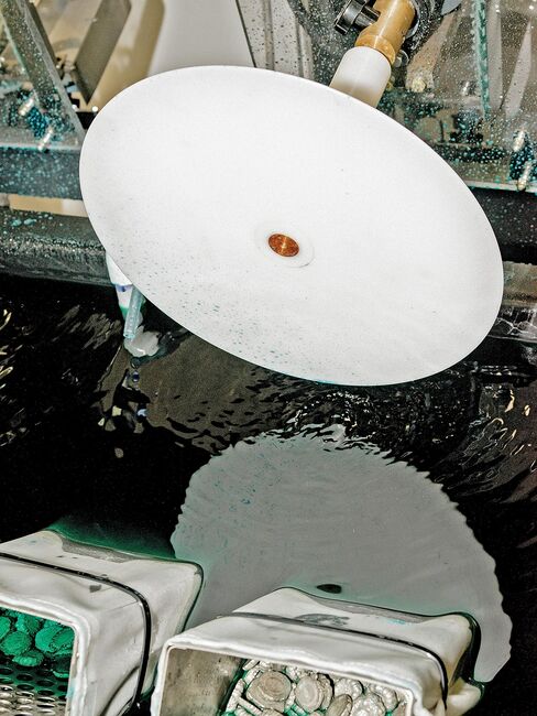 1. Each new record begins with a “lacquer,” the master disc sent by a record label. It’s dipped into a nickel solution; the nickel is peeled off the lacquer to become the “stamper,” which is fitted into a record press. QRP “plates” lacquers within four hours of receiving them because exposure to heat and humidity degrades audio quality.