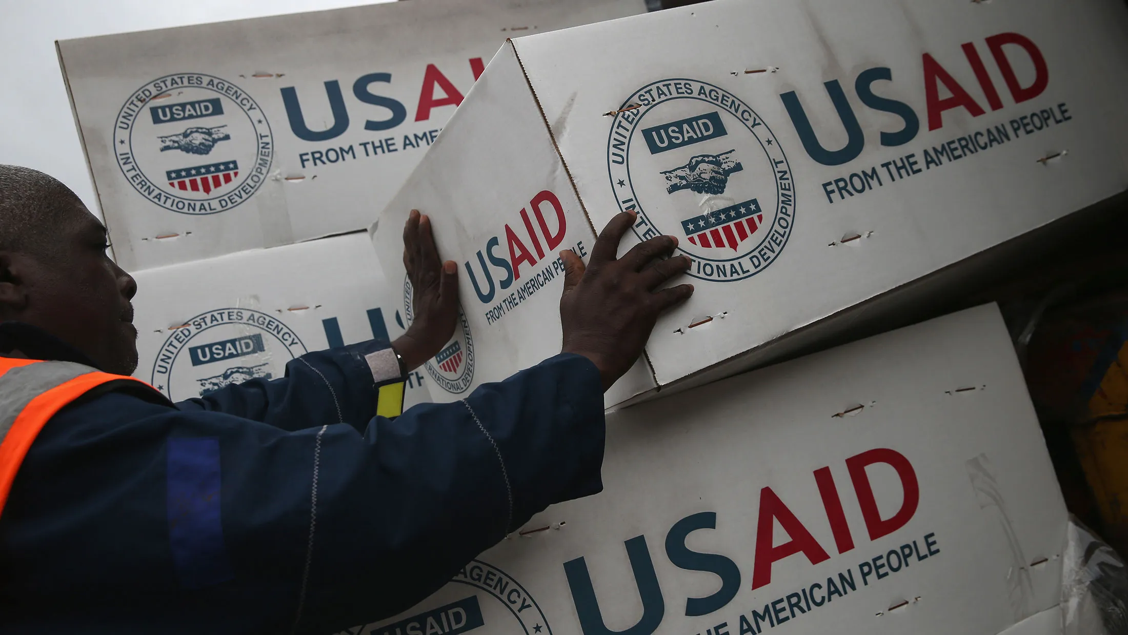 Workers unload medical supplies to fight the Ebola epidemic from a USAID cargo flight on Aug. 24, 2014, in Harbel, Liberia.
