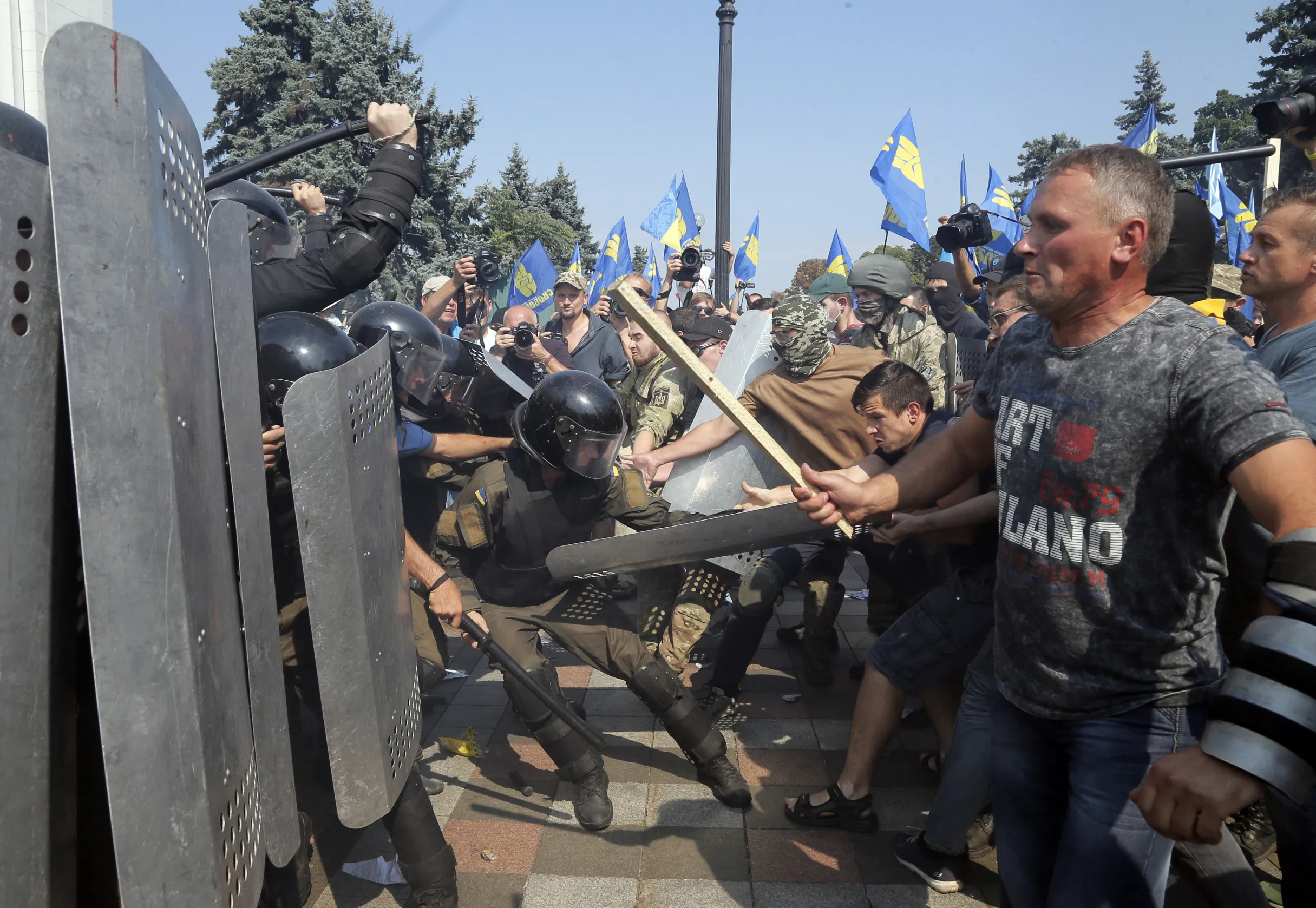 Ukrainian protesters clash with police after a vote to give greater powers to the east, outside the Parliament, in Kiev, Ukraine, on Aug. 31, 2015.
