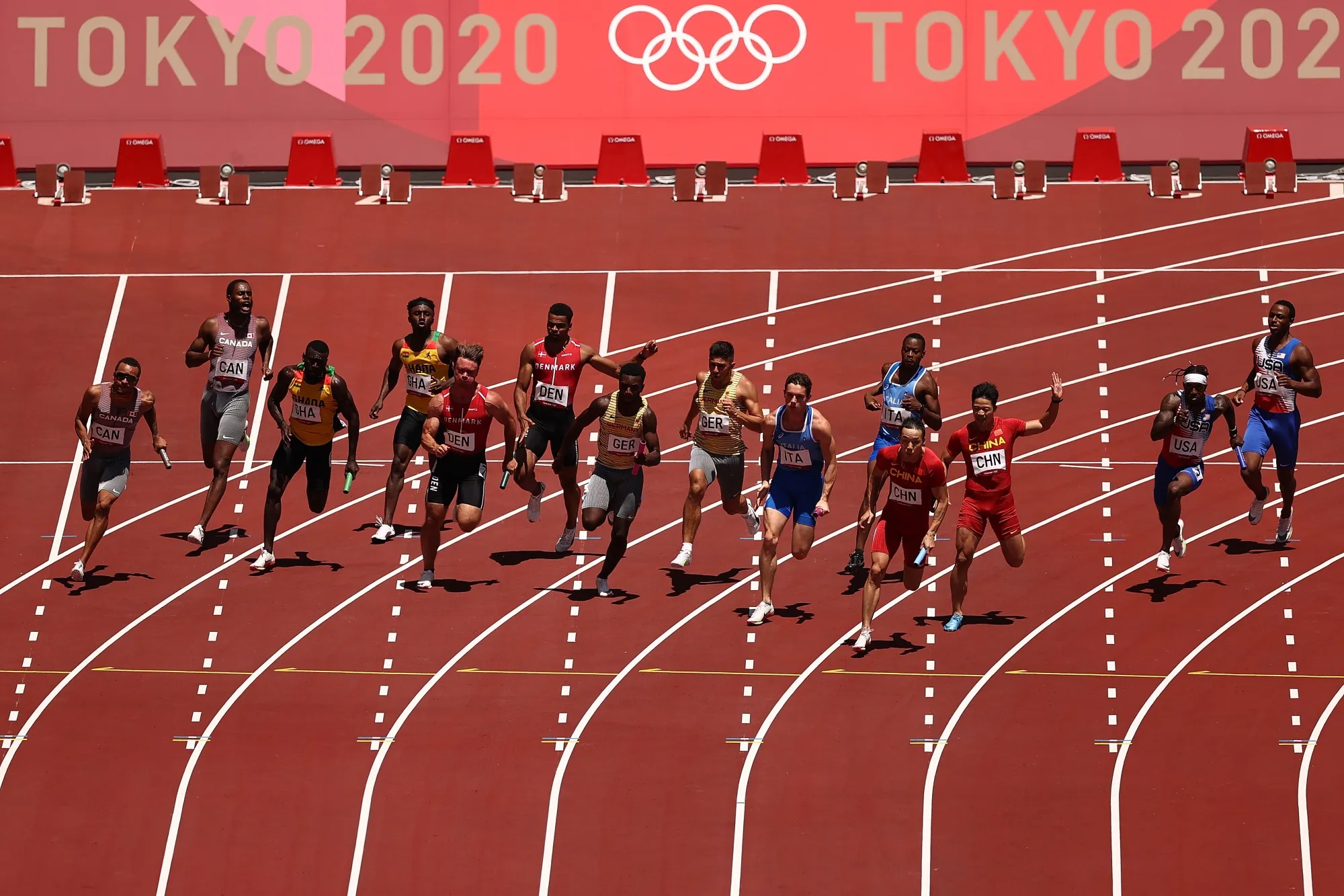 Runners pass the batons in round one of the Men's 4x100m Relay heats at Olympic Stadium&nbsp;in Tokyo, on Aug. 5.