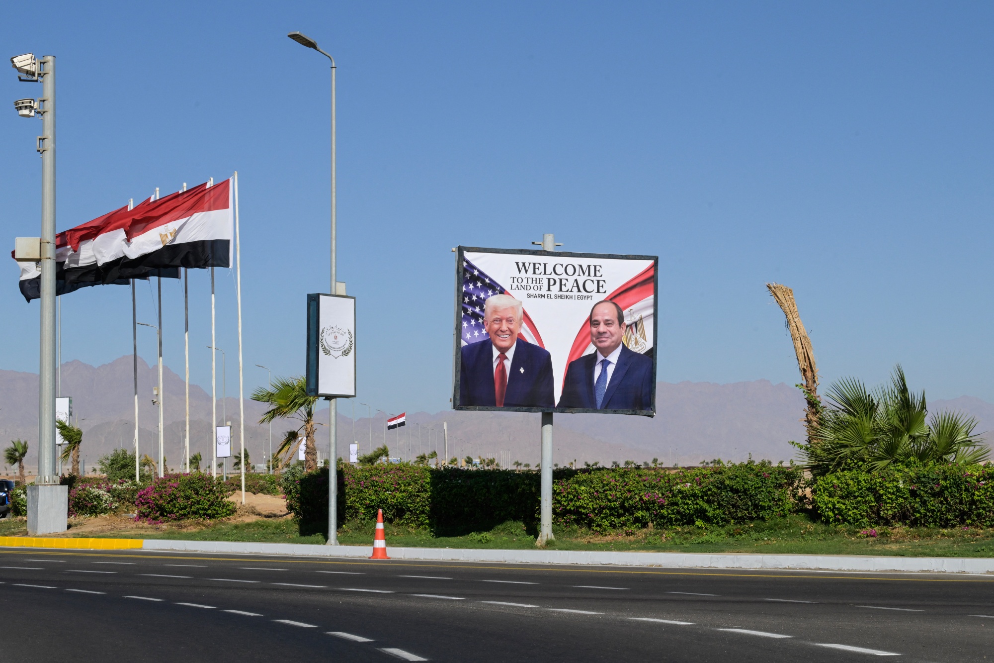 A billboard with images of Donald Trump and Abdel Fattah al-Sisi on an empty highway near the congress centre in Sharm el-Sheikh, on Oct. 13.