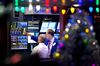 Traders work on the floor of the New York Stock Exchange (NYSE) in New York, U.S..