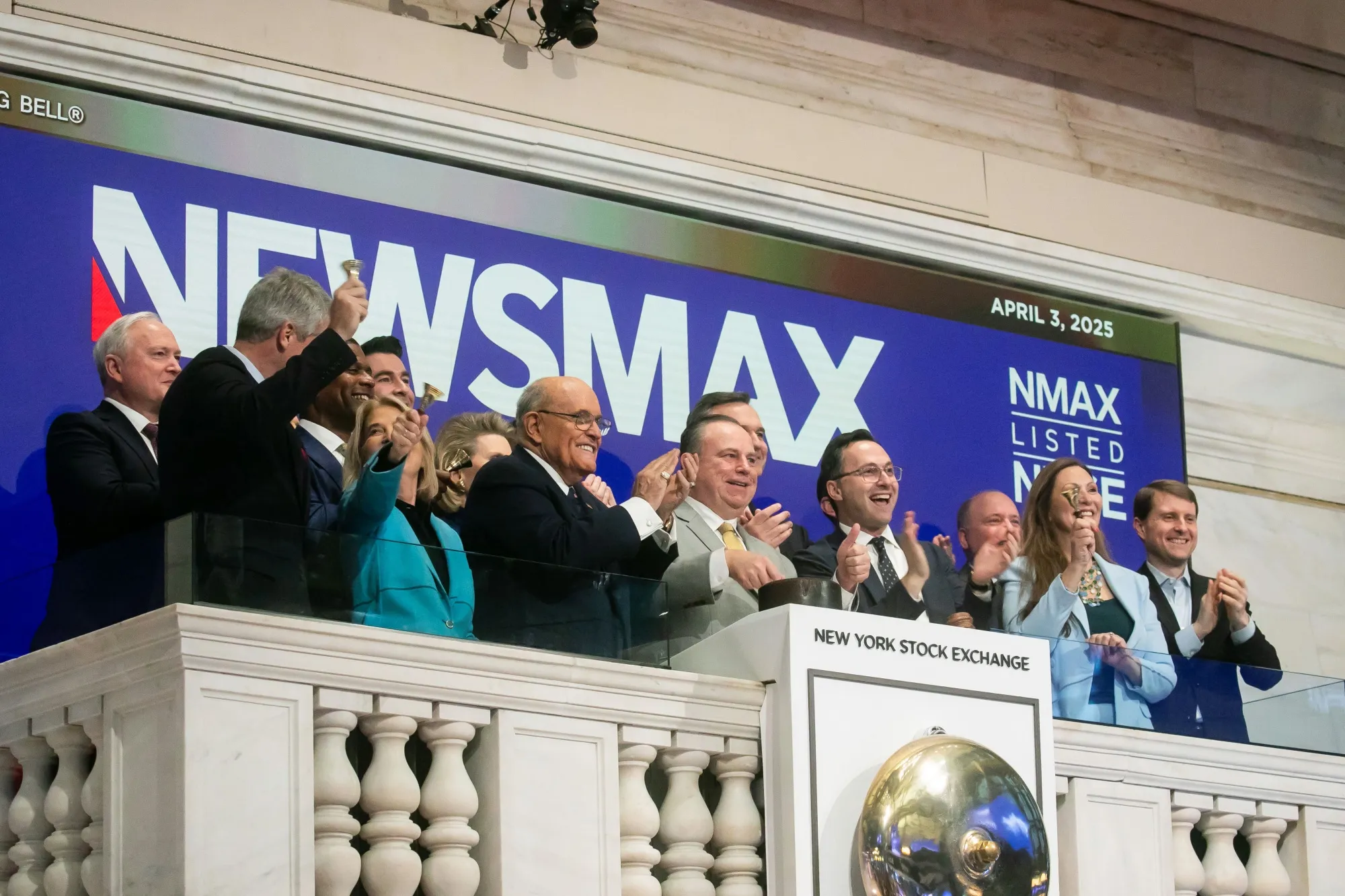 Newsmax employees rang the opening bell on the floor of the New York Stock Exchange Thursday. The company’s shares shed more than three-quarters of their value on Wednesday. On Thursday, the market as a whole dived following President Donald Trump’s announcement of new tariffs.