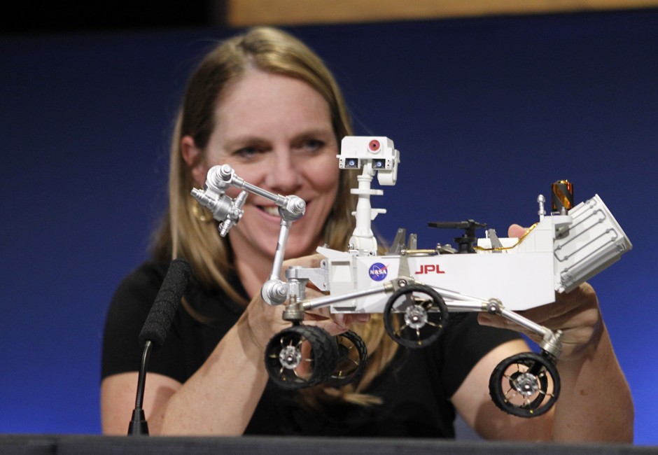 JPL's Jennifer Trosper with a model of the Curiosity rover at a press conference in 2012