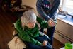 In Greenlawn, N.Y., home health aide Natalia Hubbard helps her client, Noriko Morimoto, who is 82 years old and has Parkinson’s.