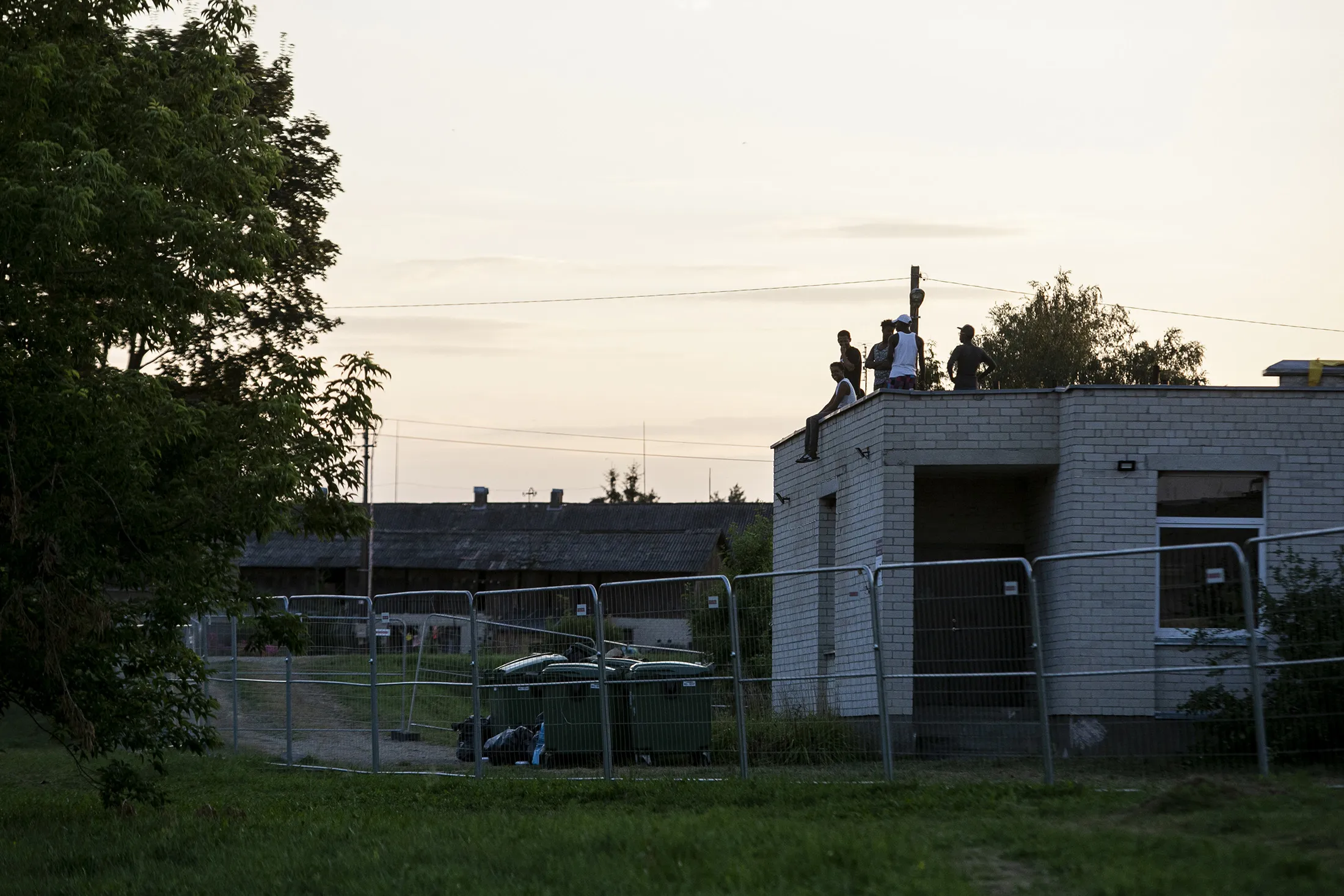 Migrants held at a detention center after crossing the border from Belarus in Vydeniai, Lithuania, on&nbsp;July 29.