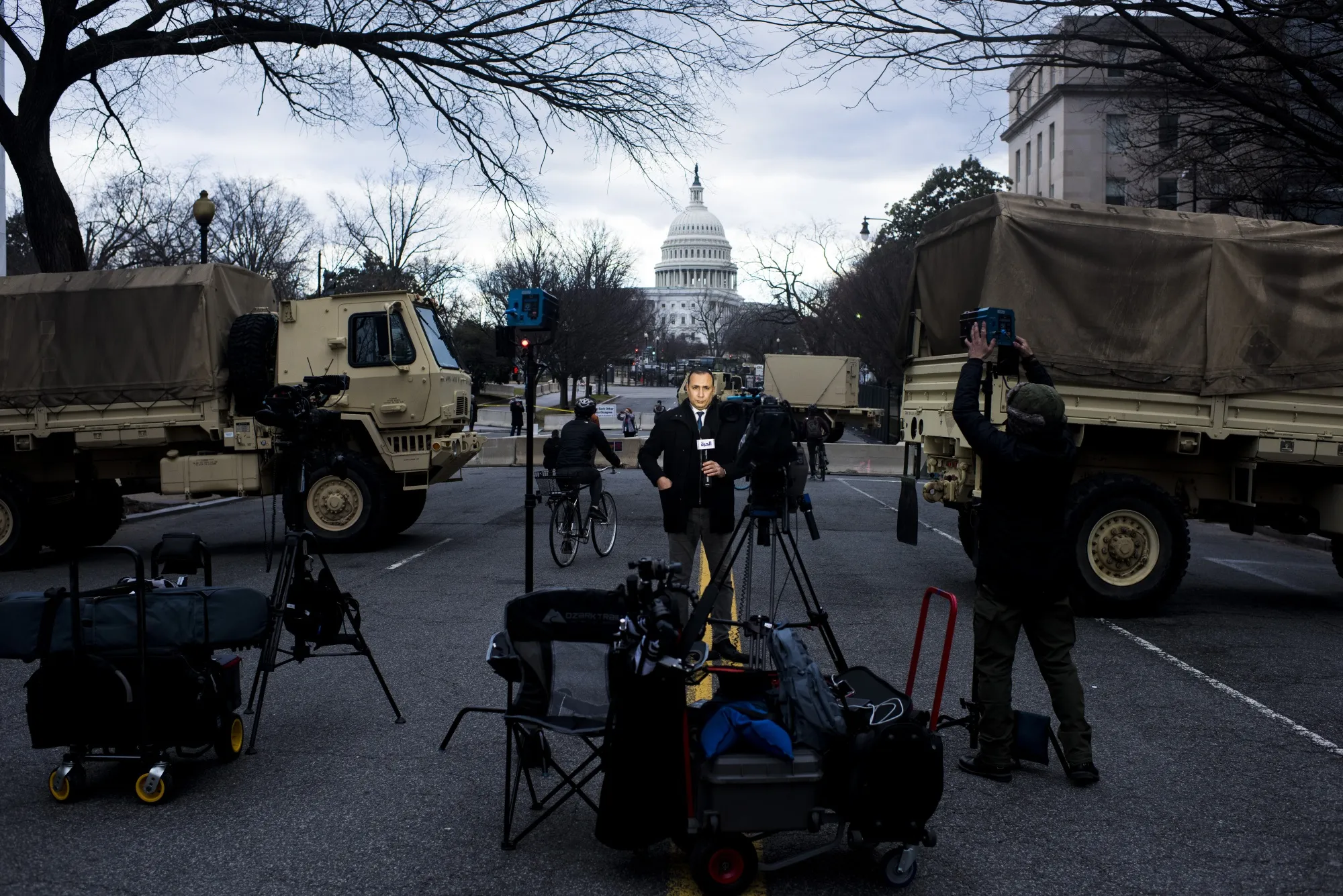 A member of the media reports from outside the U.S. Capitol in Washington, D.C. on Sunday.
