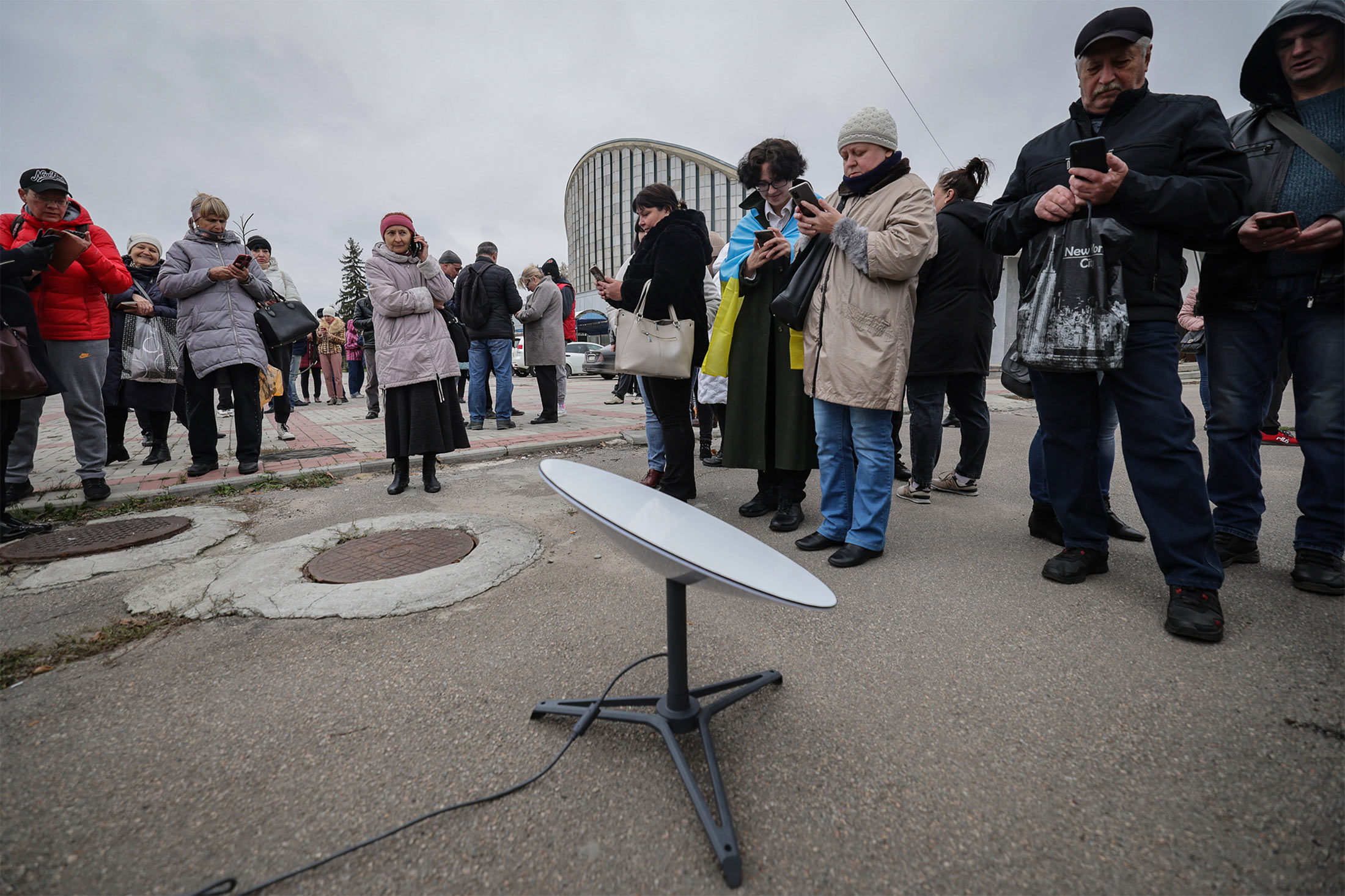 Residents use the internet from the Starlink network, set up by the Ukrainian army in Kherson, Ukraine, on&nbsp;Nov. 13, 2022.