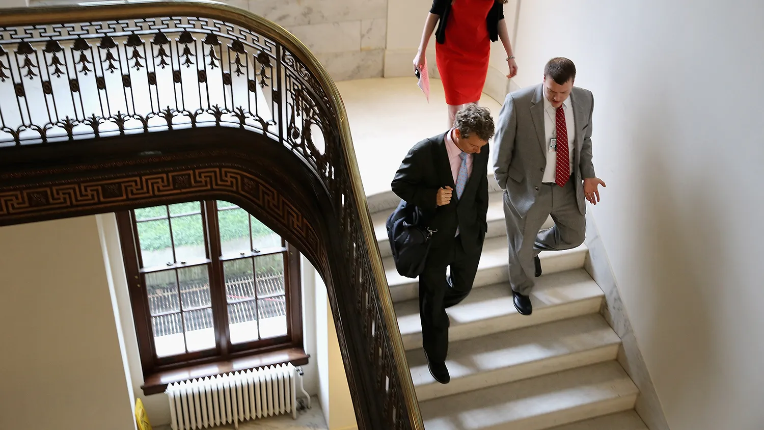 U.S. Sen. Rand Paul (R-KY) (L) heads back to his office after two television interviews in the Russell Senate Office Building on Capitol Hill June 1, 2015 in Washington, DC.
