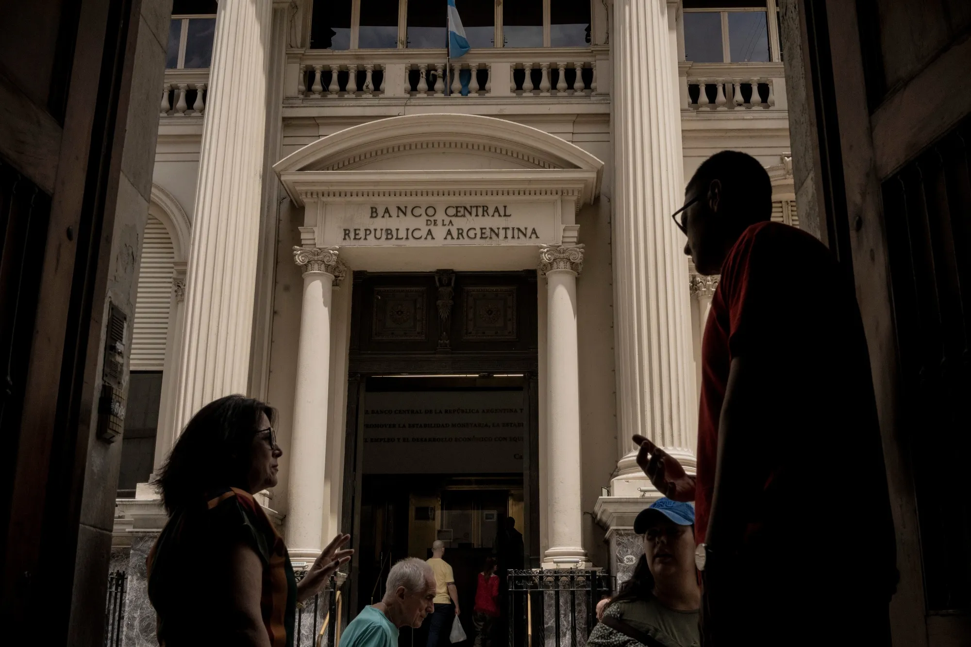 Pedestrians outside the Central Bank of Argentina in Buenos Aires.
