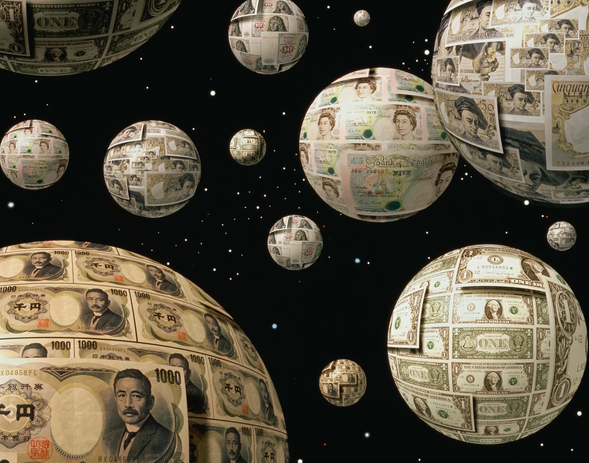 Globes covered with various currencies suspended in space
