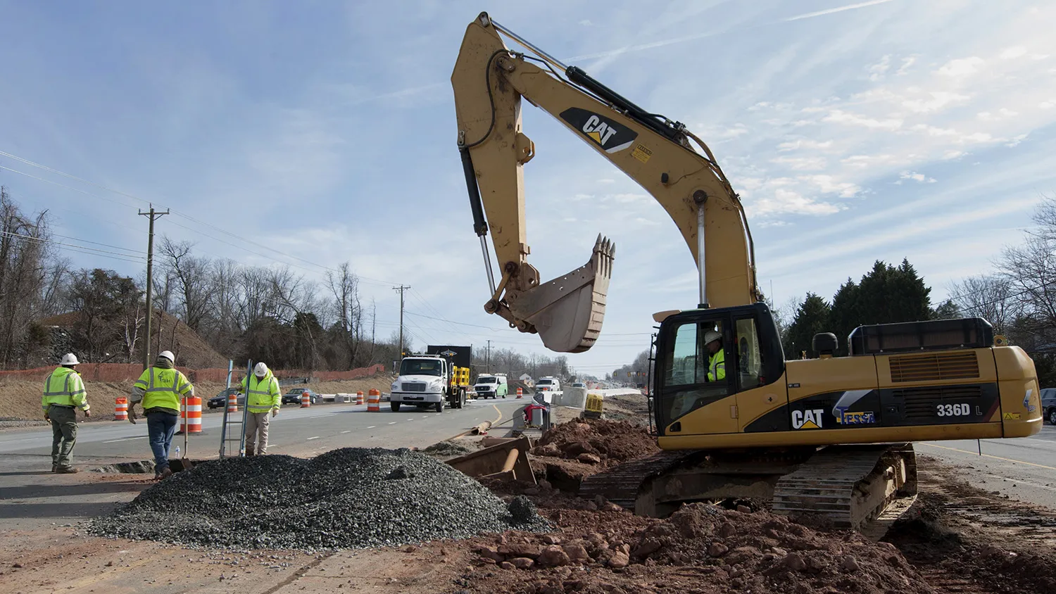 A worker operates a Caterpillar Inc. 336D hydraulic excavator during construction on Route 7 near Falls Church, Virginia, U.S., on Tuesday, Feb. 3, 2015. The U.S. Highway Trust Fund is running out of money amid congressional opposition to raising the 18.4-cents-a-gallon tax on gasoline, a levy last increased in 1993, forcing the government to keep money flowing with short-term steps.
