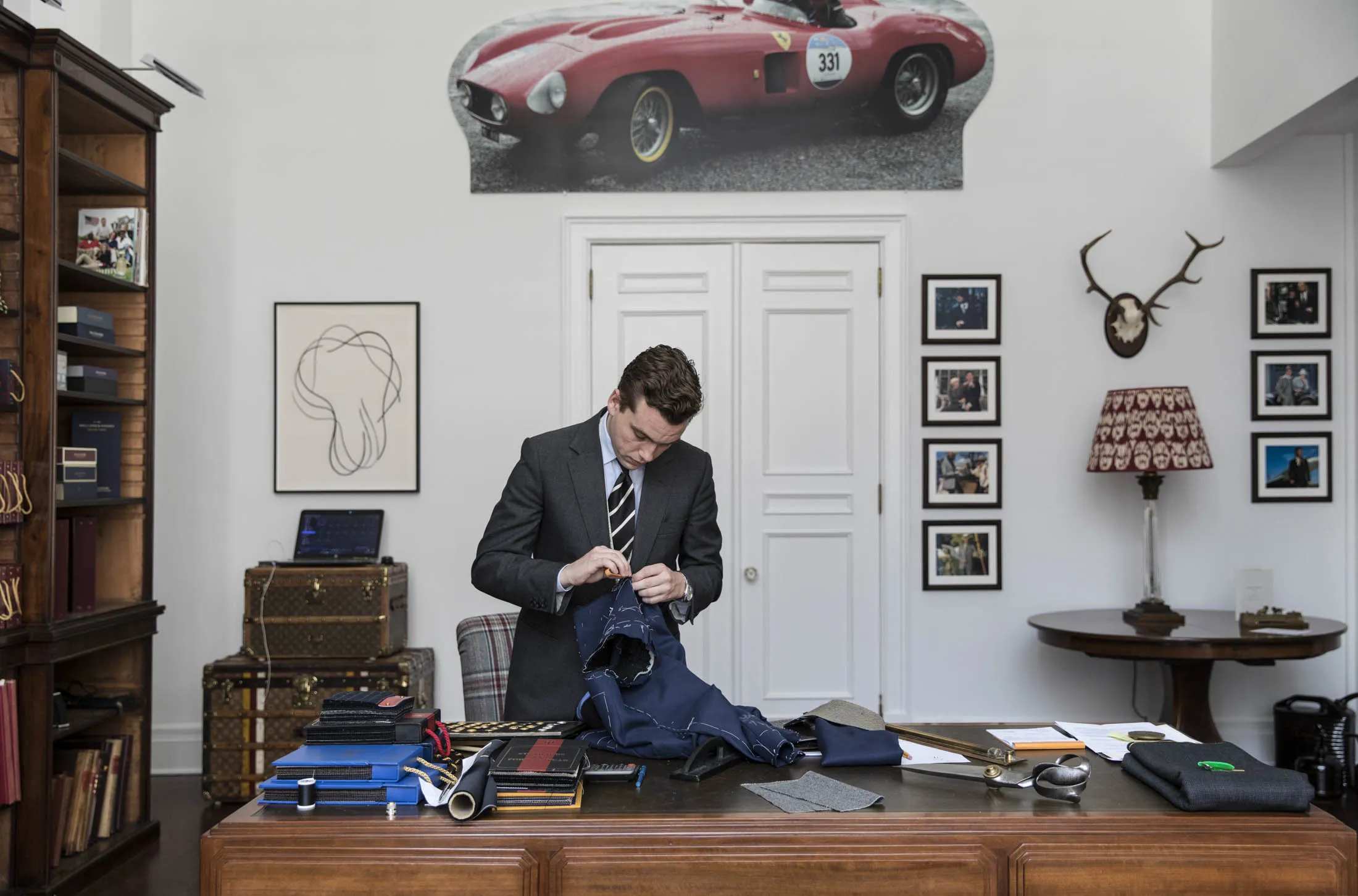Ralph Fitzgerald, the 23-year-old cutter-in-residence at Huntsman’s Manhattan outpost, works on a bespoke suit.
