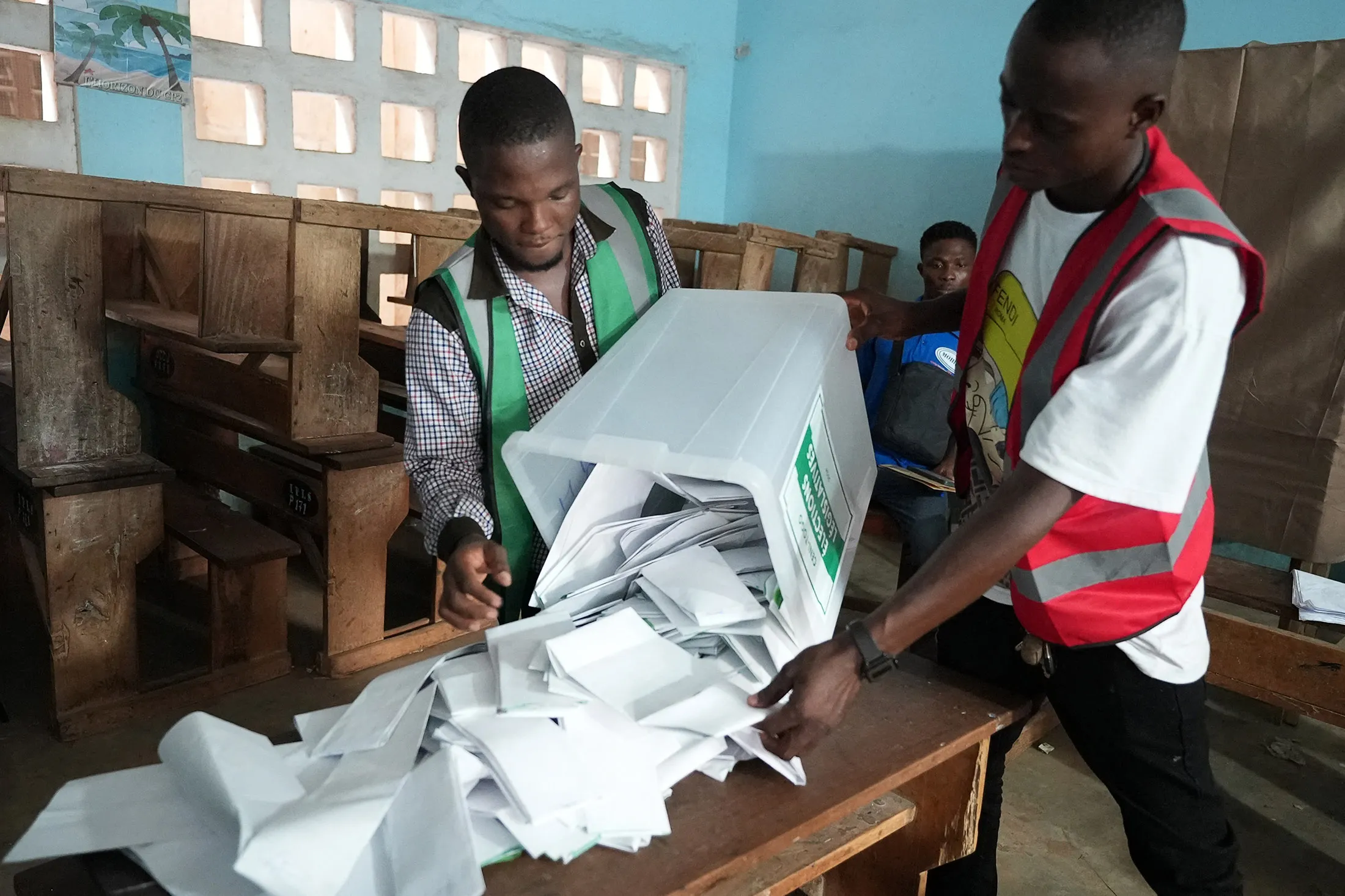 Electoral officials prepare the counting of votes at a polling station in Lome, Togo, on April 29.