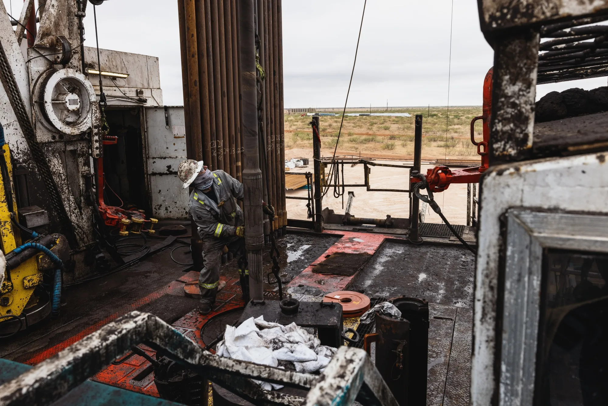 A worker drills for oil on the land&nbsp;in Andrews, Texas.